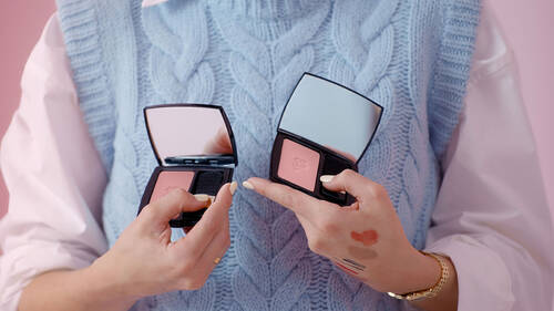 Model holding Lancome Blush Subtil palettes